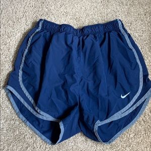 Blue Nike running shorts
